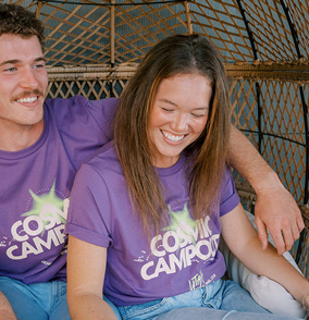 Two people wearing custom apparel